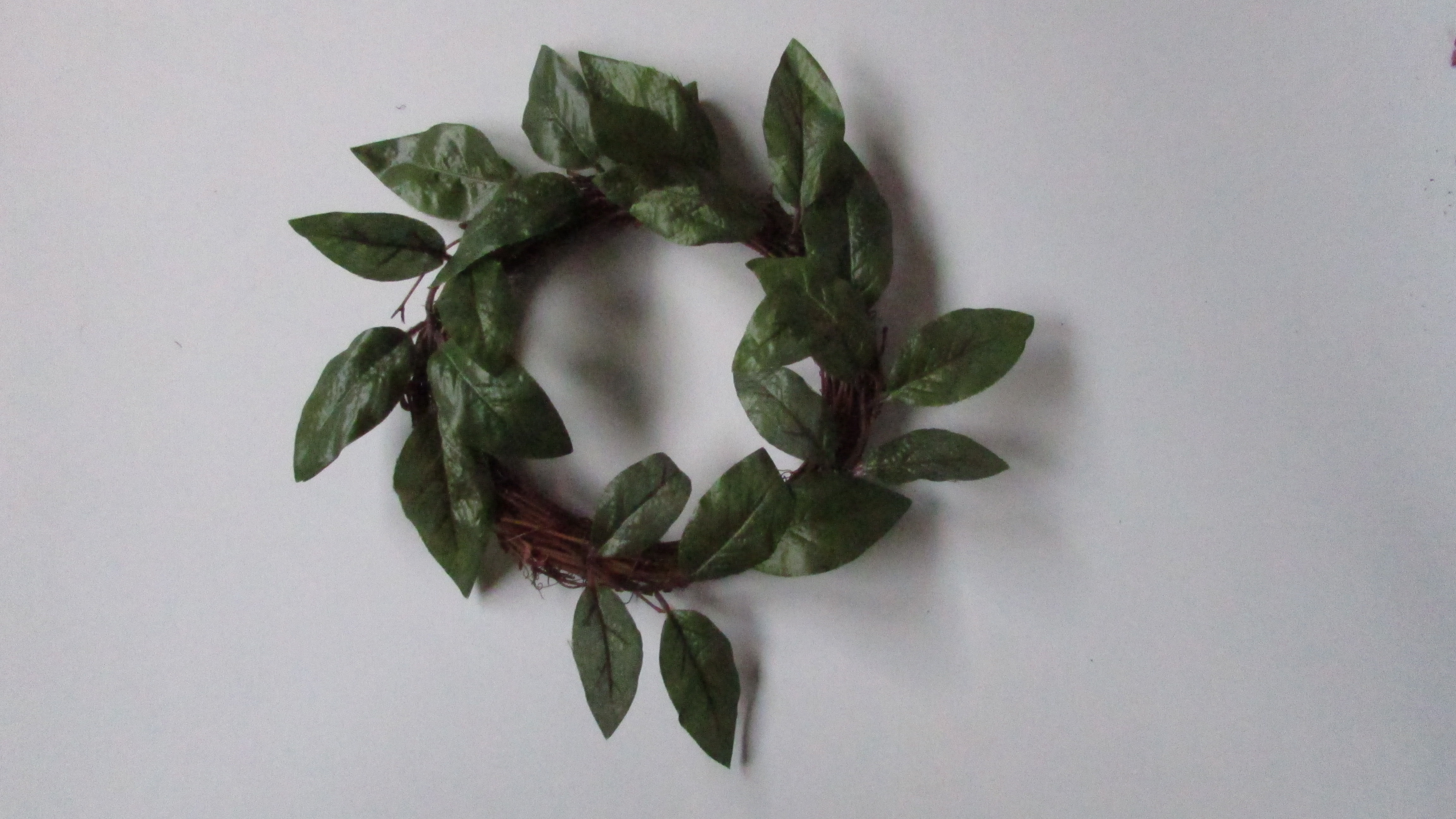 Candle ring with green leaves