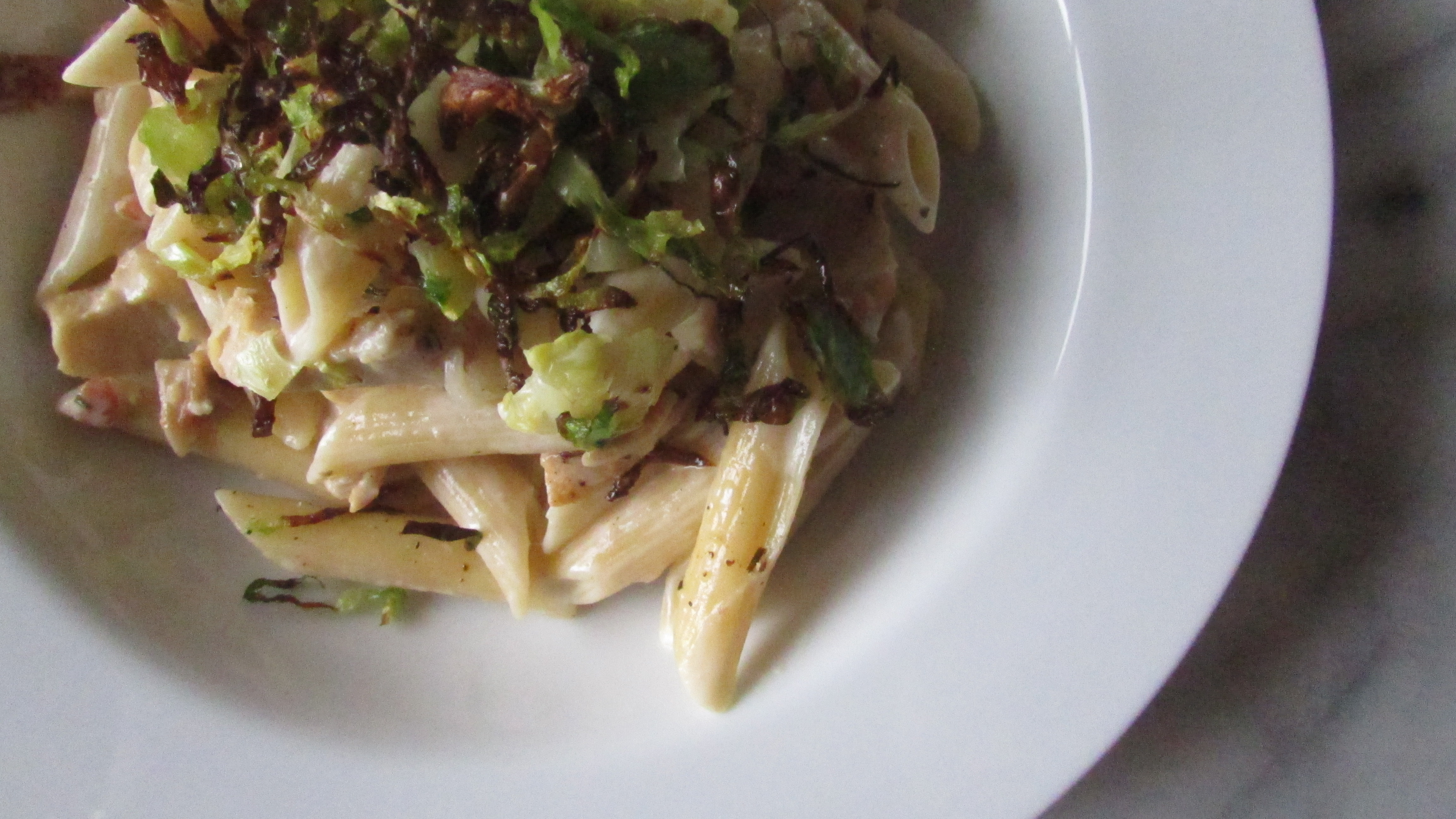 Creamy goat cheese pasta with charred Brussels sprouts