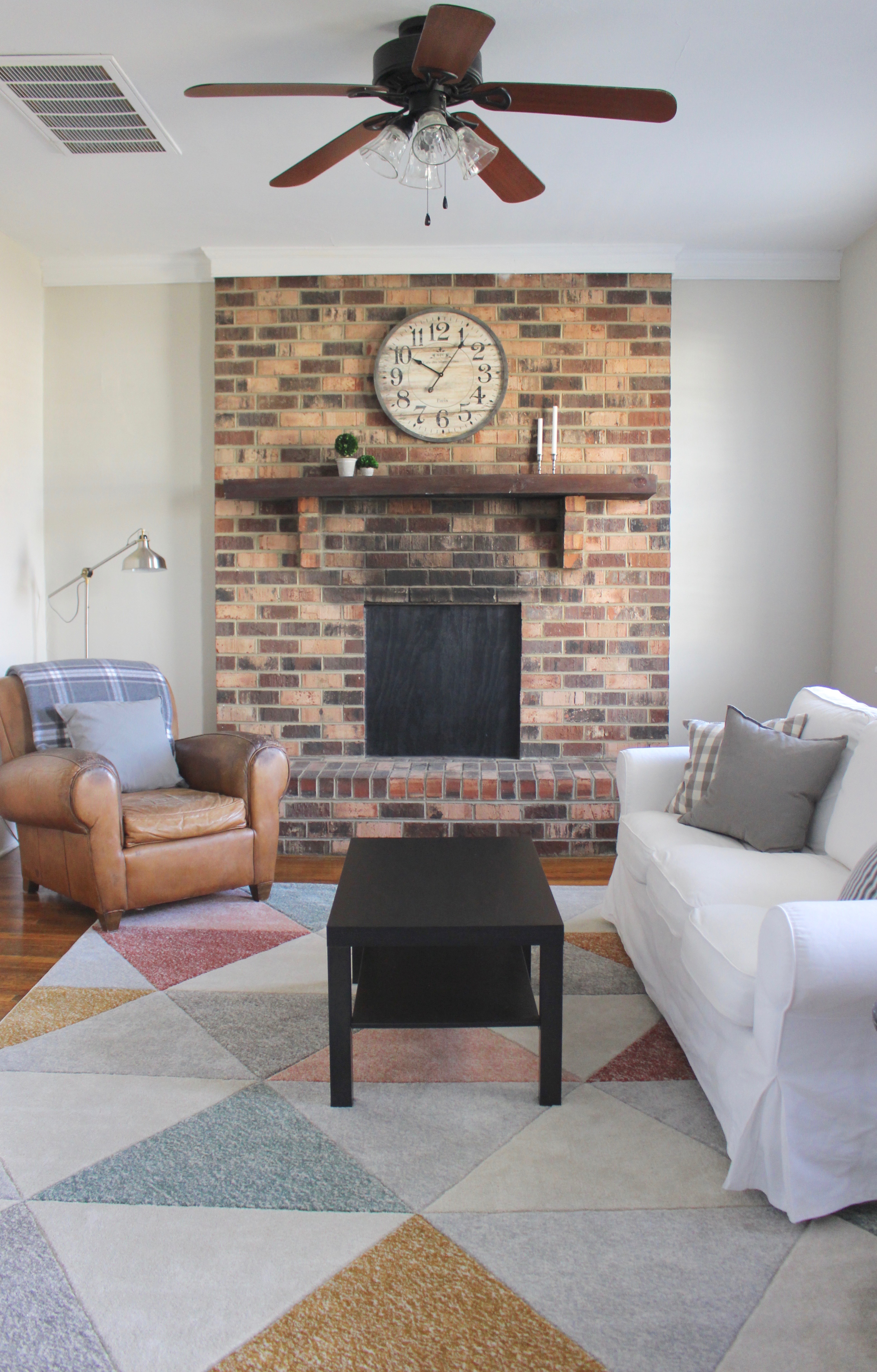 modern living room with brick mantel