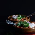 Mexican Chicken Stew | Chicken thighs get baked with pinto beans and salsa in a Dutch oven for easy, hearty Mexican comfort food.