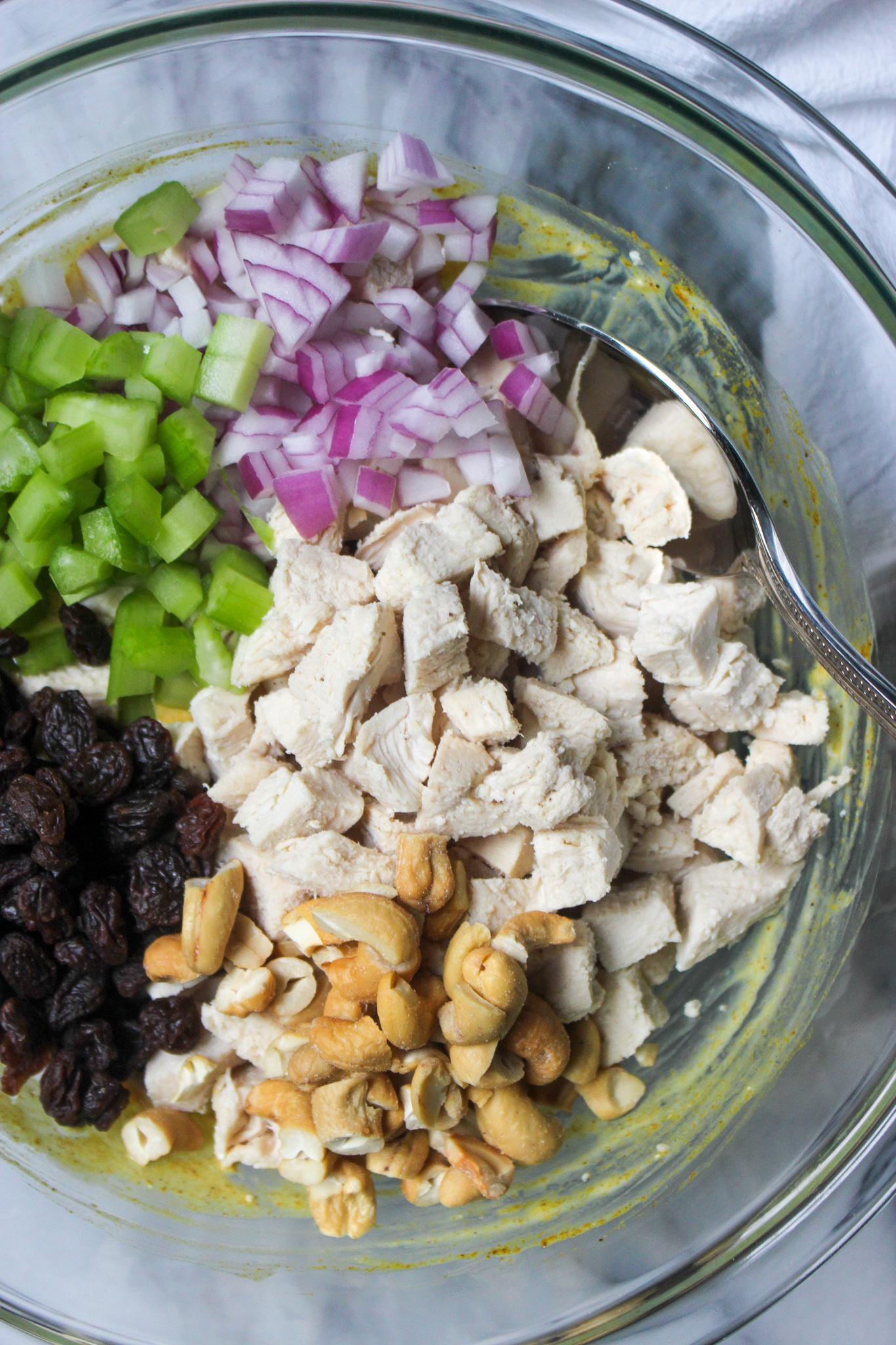 mixing ingredients for curry chicken salad