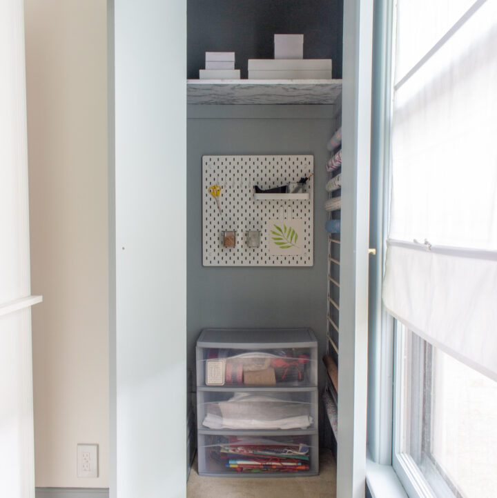 view of closet storing boxes, wrapping paper, and wrapping supplies