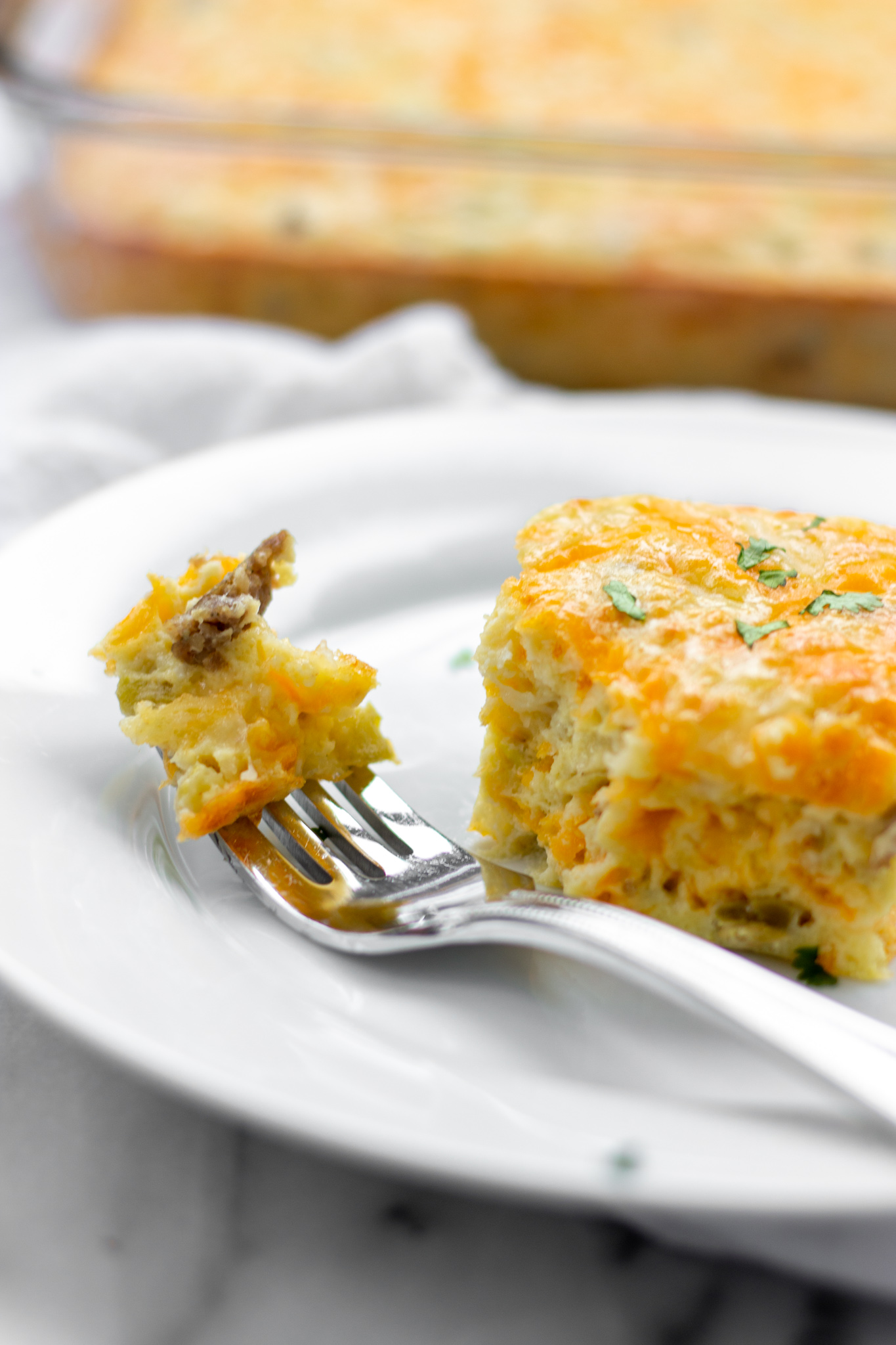 Forkful of breakfast casserole.