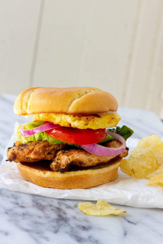 jerk chicken burger with chips on the side