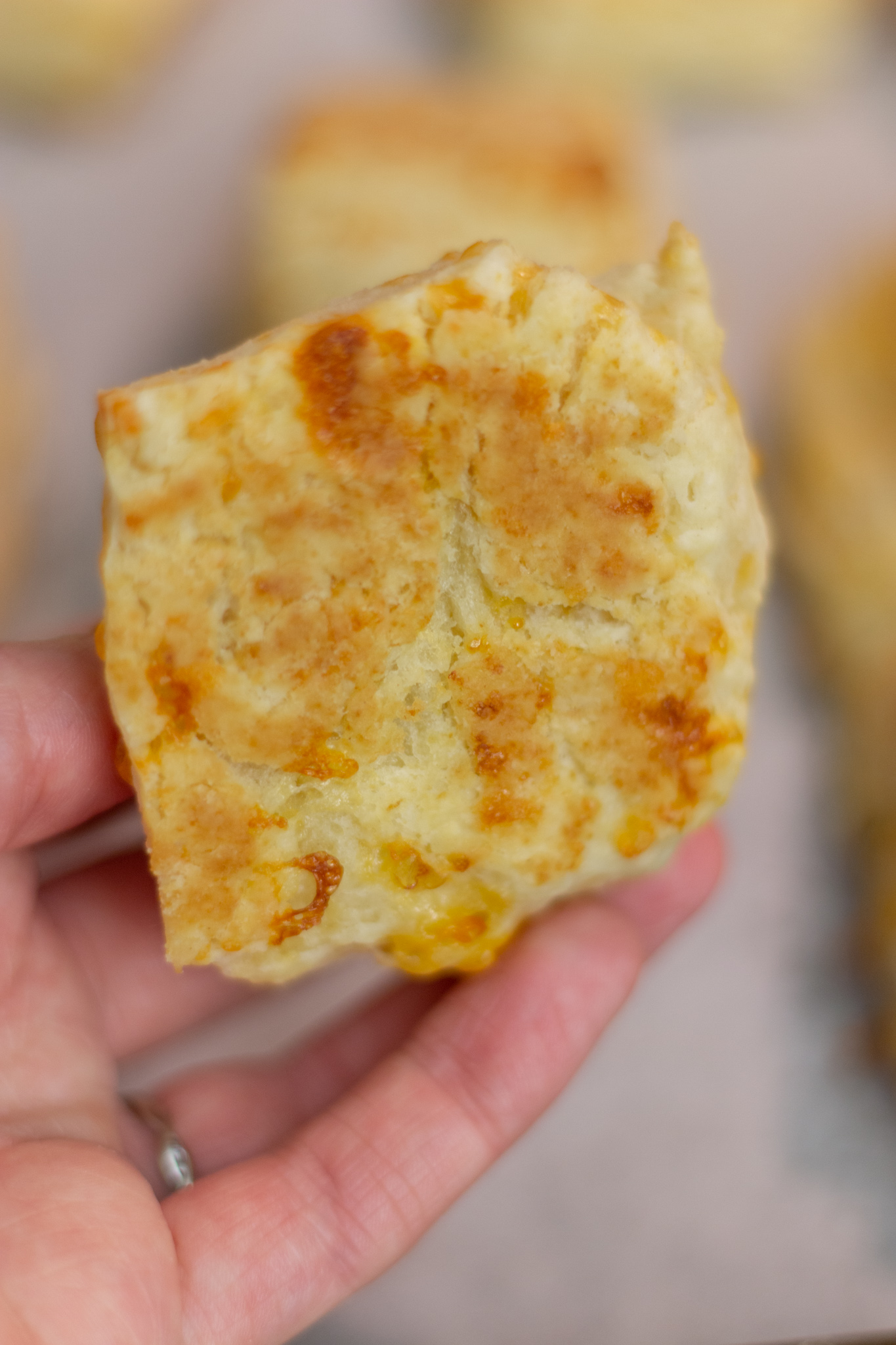 crispy cheese on the bottom of a cheddar biscuits