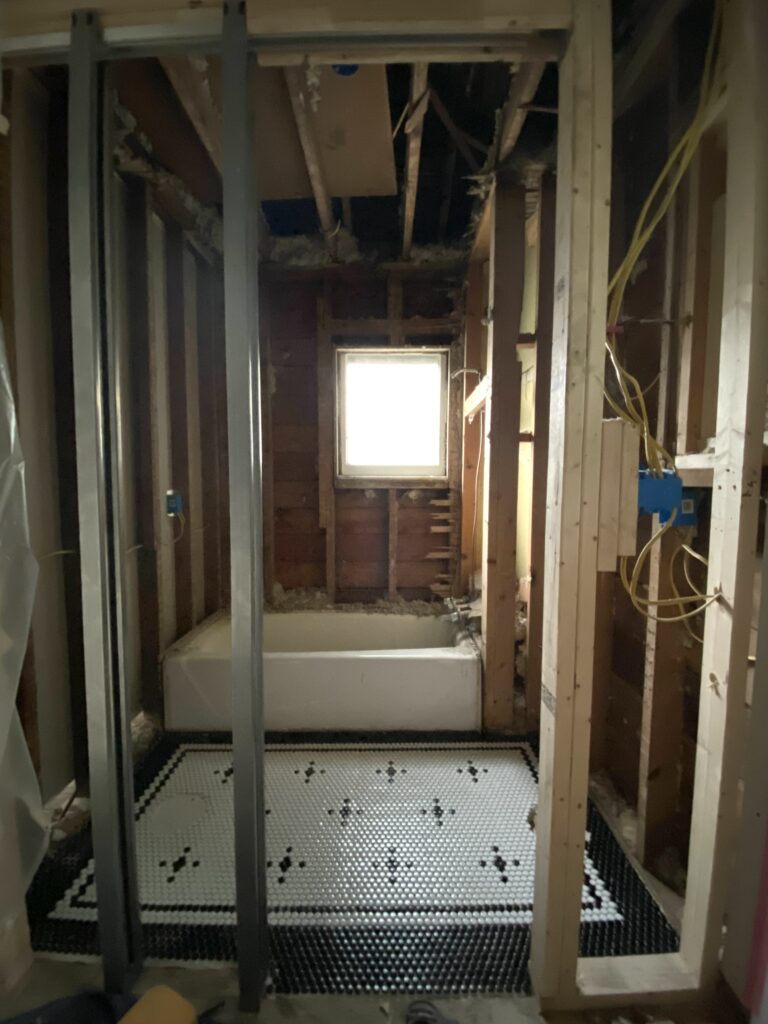 view of the bathroom through the pocket door framing